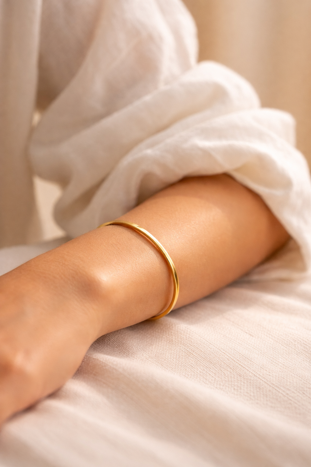 Woman wearing The Luna Cuff gold bracelet